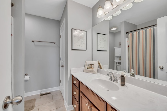 bathroom with vanity and tile patterned floors