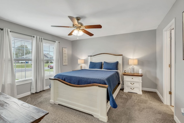 bedroom with ceiling fan and carpet