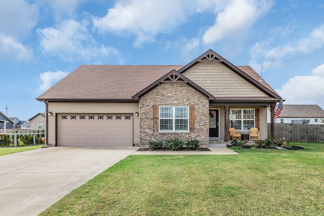 view of front of property featuring a garage and a front yard