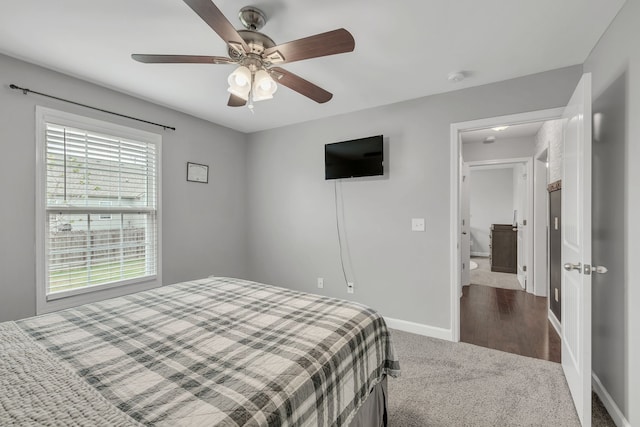 carpeted bedroom featuring ceiling fan