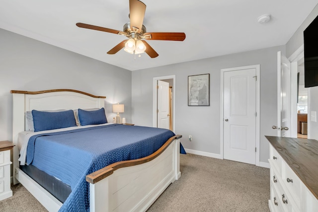 bedroom with ceiling fan and light colored carpet