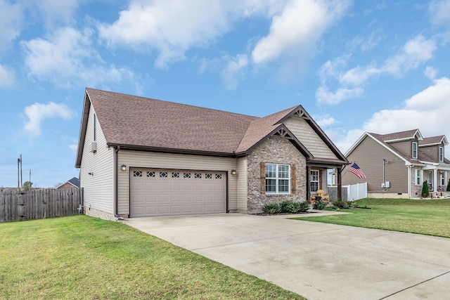 view of front of property featuring a garage and a front lawn