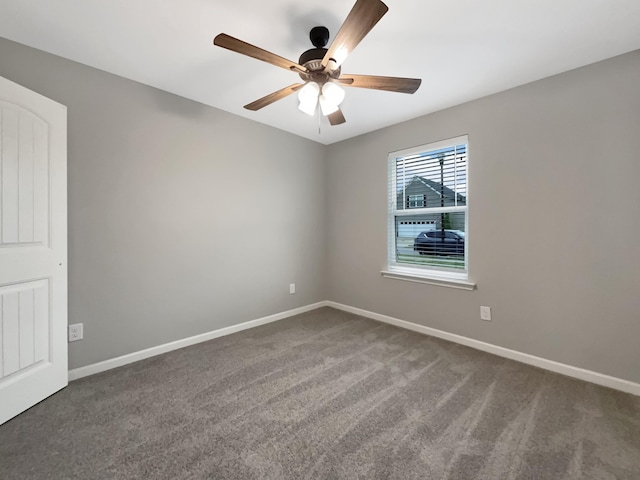 carpeted empty room featuring ceiling fan