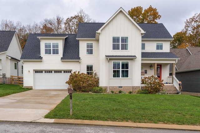 view of front of house featuring a front lawn, a garage, and a porch