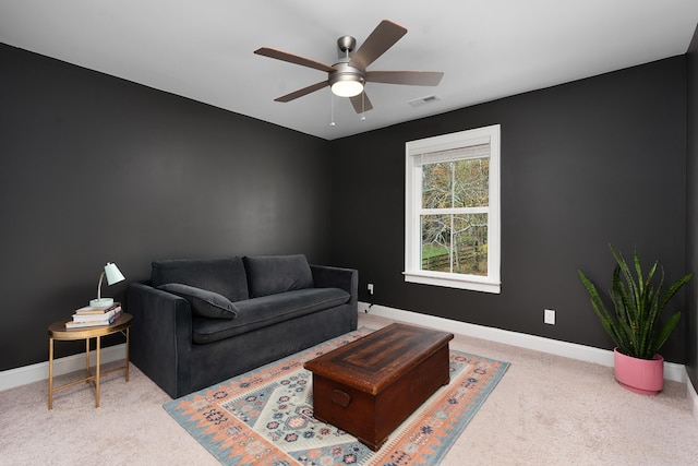 living room featuring ceiling fan and carpet floors