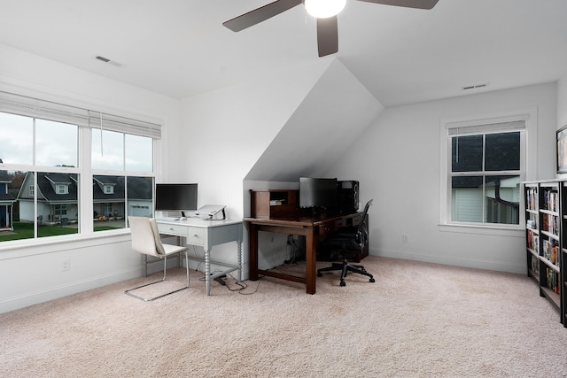 office area featuring vaulted ceiling, ceiling fan, and carpet floors