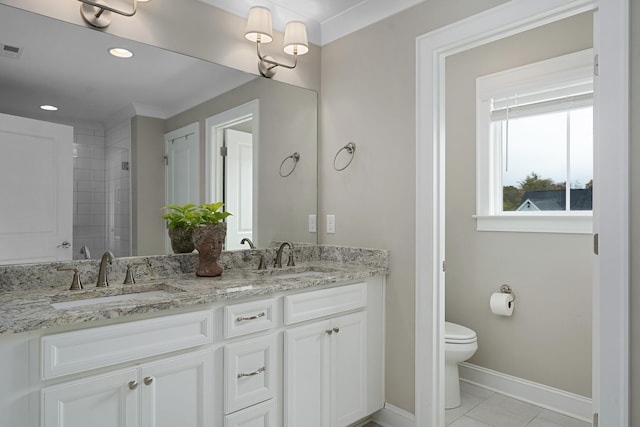 bathroom featuring crown molding, toilet, vanity, and tile patterned floors