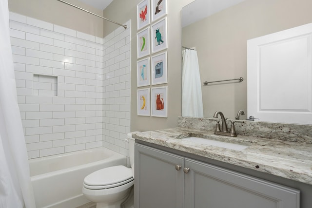 full bathroom featuring shower / bath combo, vanity, and toilet