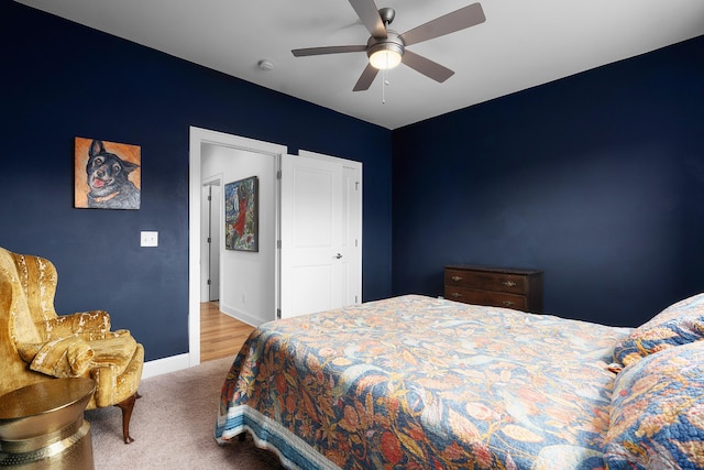 carpeted bedroom featuring ceiling fan