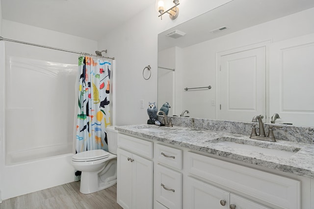 full bathroom featuring toilet, vanity, shower / bath combo with shower curtain, and hardwood / wood-style flooring