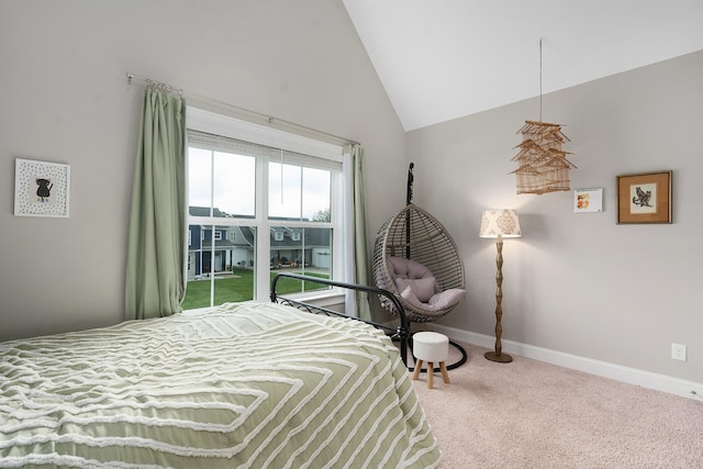 bedroom featuring high vaulted ceiling and carpet floors