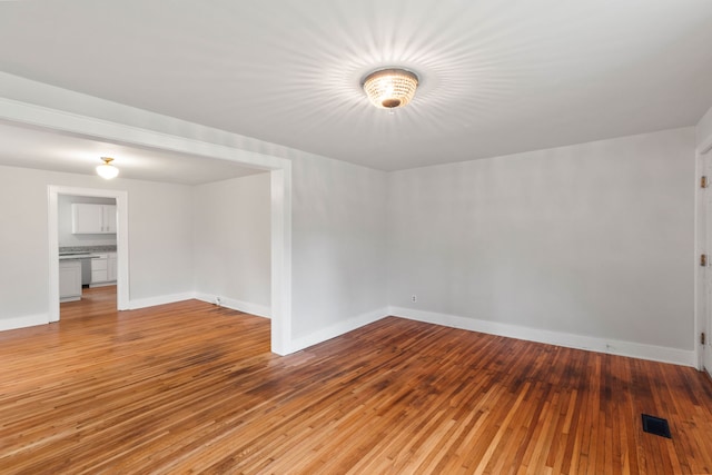 empty room with light hardwood / wood-style flooring