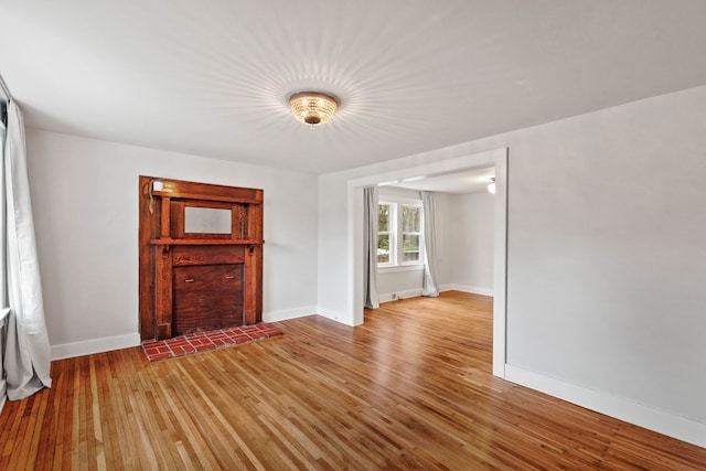 unfurnished living room with light hardwood / wood-style floors