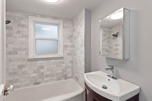 bathroom with vanity and tiled shower / bath combo