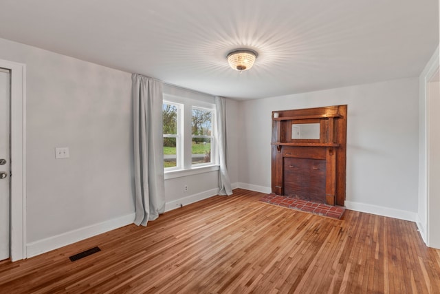 unfurnished living room featuring light wood-type flooring