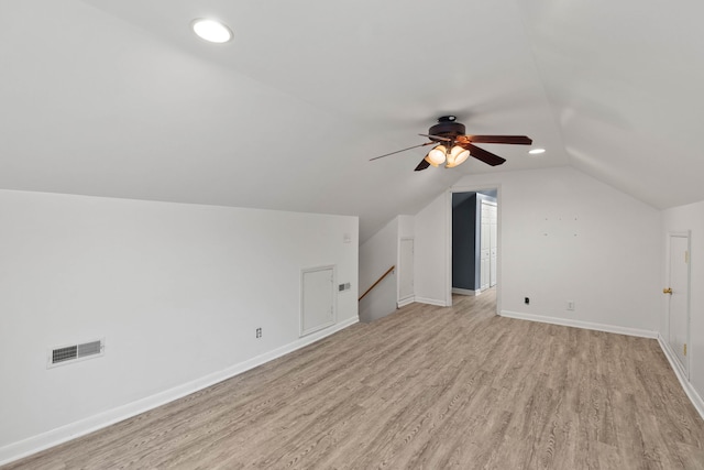 additional living space with light wood-type flooring, lofted ceiling, and ceiling fan