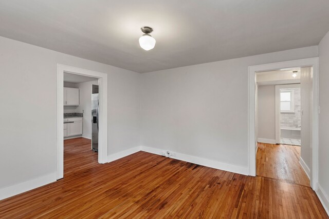 spare room featuring light hardwood / wood-style floors