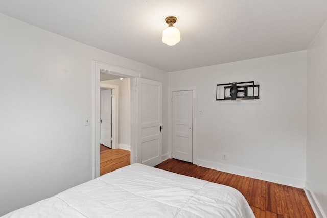 bedroom featuring a closet and wood-type flooring