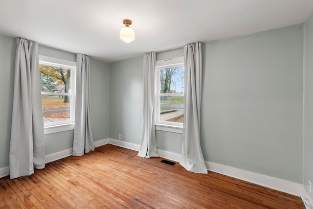 empty room with light hardwood / wood-style floors