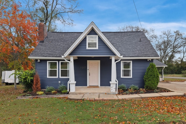 view of front of property with a front lawn and a porch