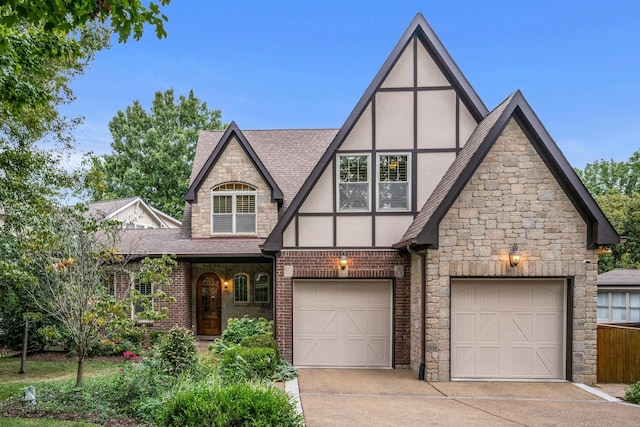 tudor home featuring a garage