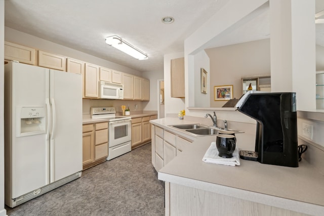 kitchen with kitchen peninsula, light carpet, white appliances, sink, and light brown cabinets