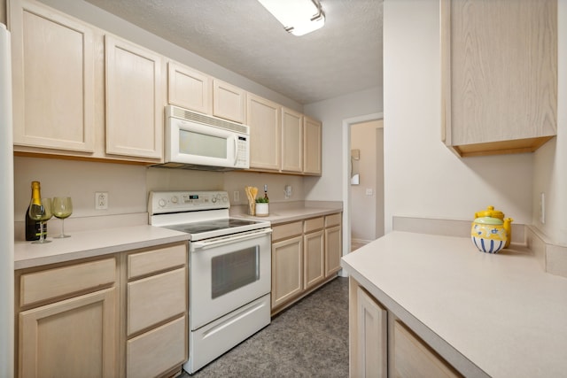 kitchen featuring light brown cabinets, white appliances, and a textured ceiling