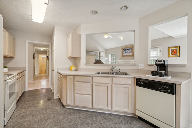 kitchen featuring white appliances, sink, ceiling fan, a textured ceiling, and light brown cabinetry