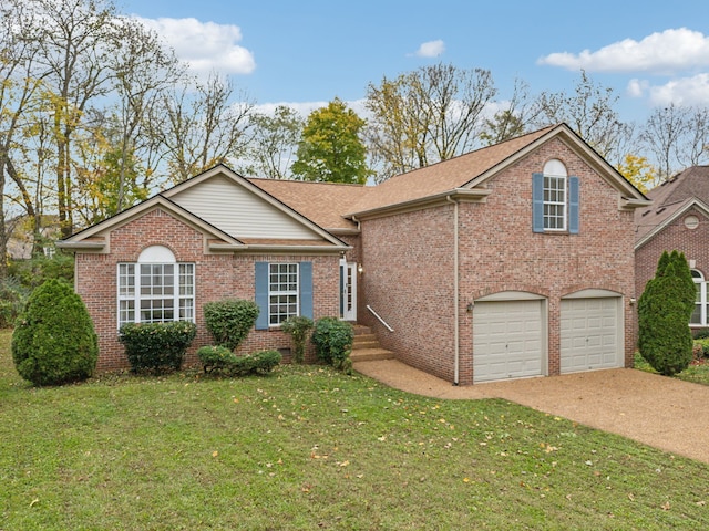 view of front of property featuring a front yard and a garage