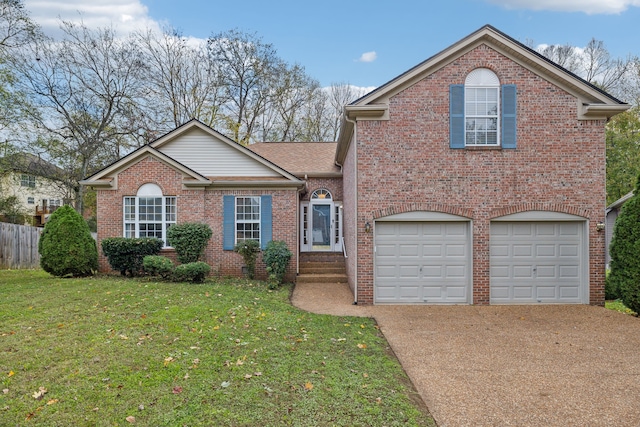 view of front of property featuring a front lawn and a garage