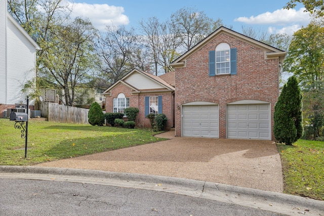 view of property with a garage and a front yard