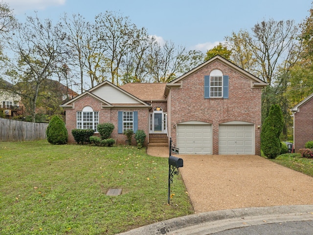 view of front of home featuring a garage and a front yard