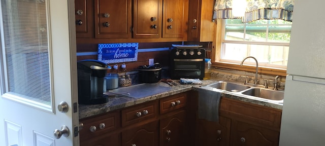 kitchen with sink and white refrigerator