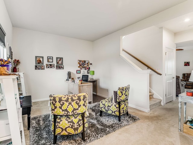 living area with light carpet