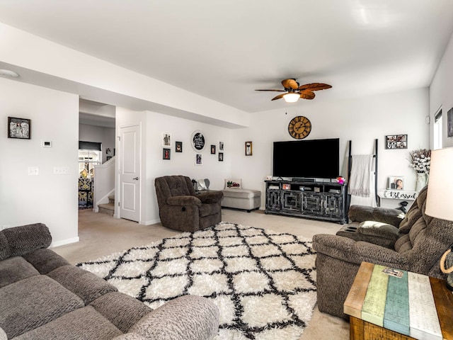 living room featuring carpet flooring and ceiling fan