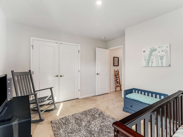 carpeted bedroom featuring a closet