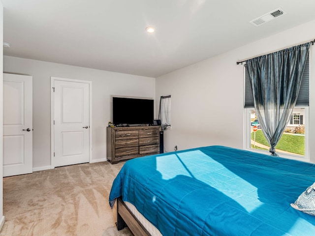 bedroom with light colored carpet