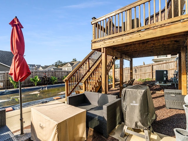 view of patio / terrace with a wooden deck and area for grilling