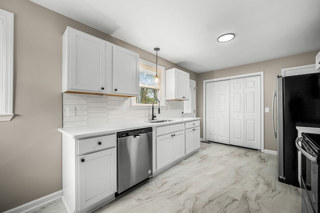 kitchen with white cabinetry, appliances with stainless steel finishes, backsplash, pendant lighting, and sink