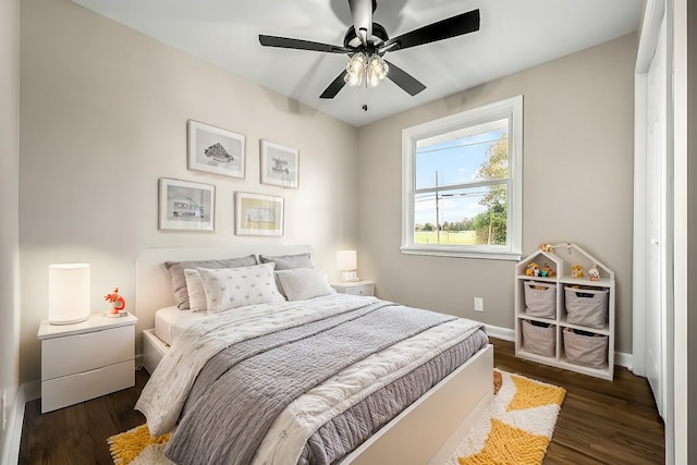 bedroom featuring ceiling fan and dark hardwood / wood-style floors