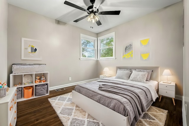 bedroom featuring dark hardwood / wood-style flooring and ceiling fan