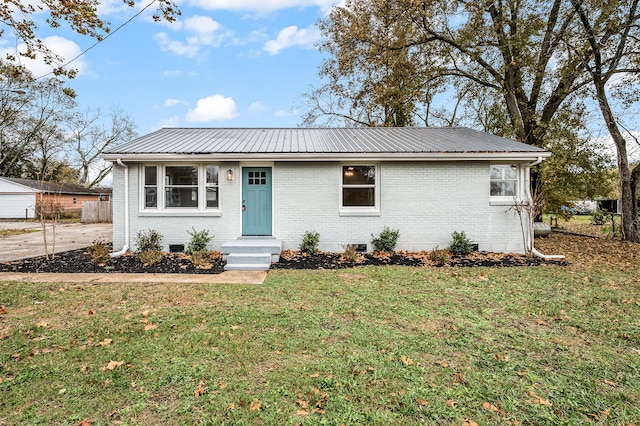 ranch-style home with a front lawn