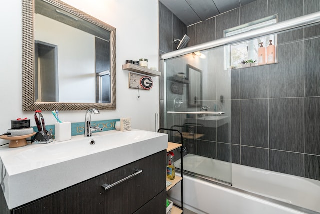 bathroom featuring vanity and enclosed tub / shower combo