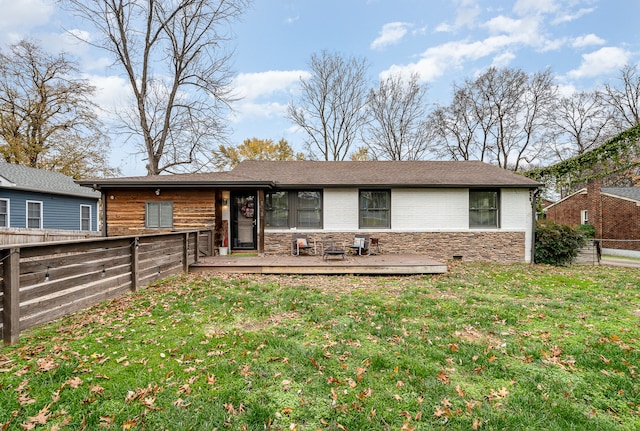 view of front of home featuring a wooden deck and a front lawn