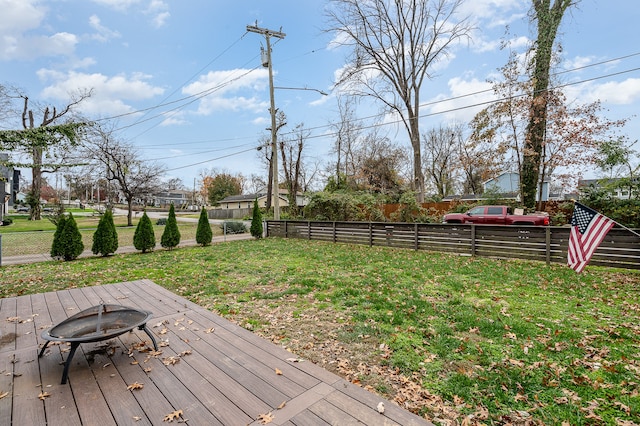 exterior space featuring a lawn and a fire pit