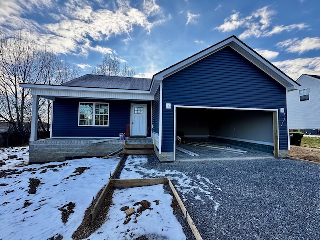 view of front of house with covered porch and a garage