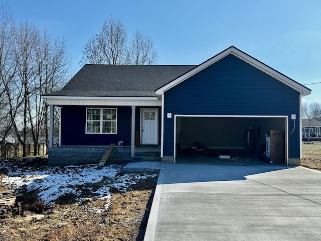 view of front facade with a garage and a porch