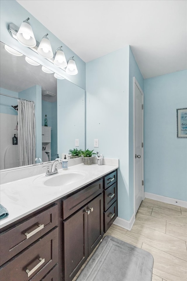 bathroom with wood-type flooring and vanity