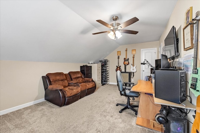 carpeted office featuring vaulted ceiling and ceiling fan