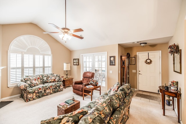 carpeted living room featuring ceiling fan and lofted ceiling